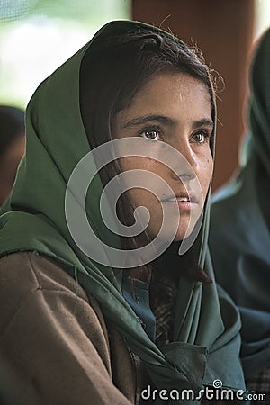 Girl learning in the only school in the village of Shimshal 3100m is a government school taught by teachers based in the village Editorial Stock Photo