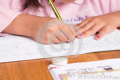 Girl learning to write Stock Photo