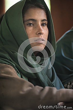 Girl learning in the only school in the village of Shimshal 3100m is a government school taught by teachers based in the village Editorial Stock Photo