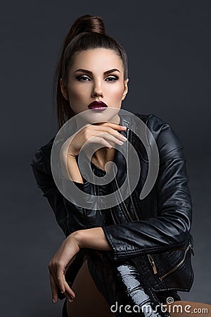 Girl in leather jacket and boots Stock Photo