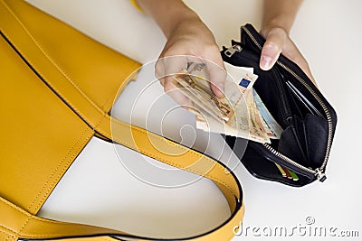 Girl with leather wallet full of money. European Euro bills Stock Photo