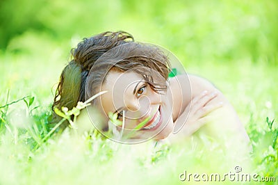 Girl lies on lawn Stock Photo