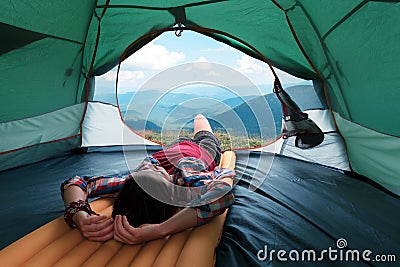 Girl lies in they tent Stock Photo