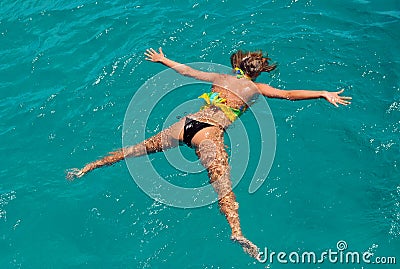 The girl lies on water Stock Photo