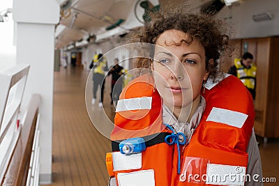 Girl in life jacket on ship Stock Photo