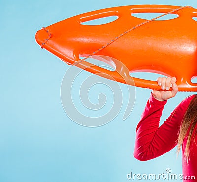 Girl lifeguard with equipment float Stock Photo