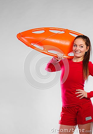 Girl lifeguard with equipment float Stock Photo