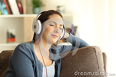 Girl listening and feeling music at home Stock Photo