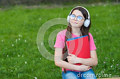 Girl listening summer melody wireless headphones nature background, hobby and leisure concept Stock Photo