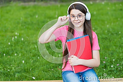 Girl listening summer melody wireless headphones nature background, pleasant moments concept Stock Photo