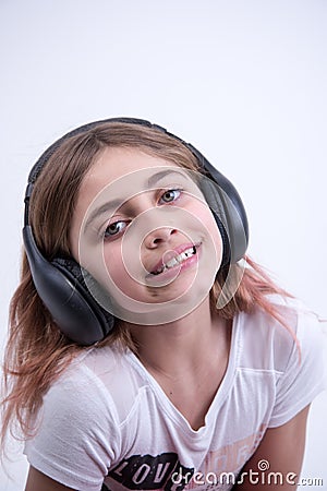 Girl listening to lovely music on headphone Stock Photo