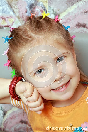 Girl listens ticking of watch Stock Photo