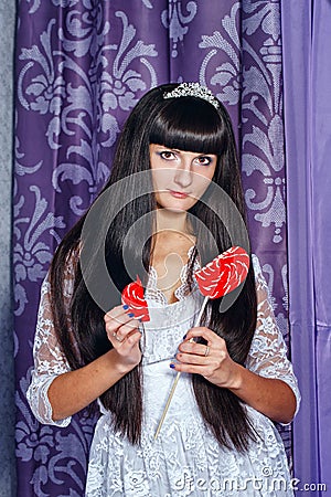 Girl and lollipop broken heart Stock Photo