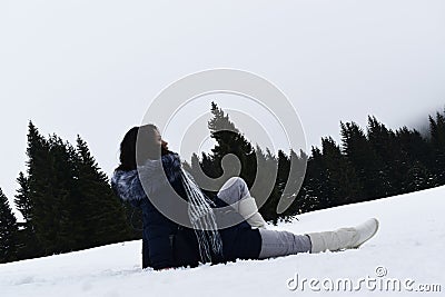 A girl seating in snow on mountain Kopaonik, Serbia, Europe Stock Photo