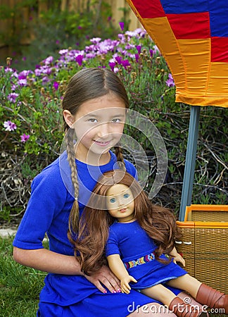 Girl with her American Girl Doll Editorial Stock Photo