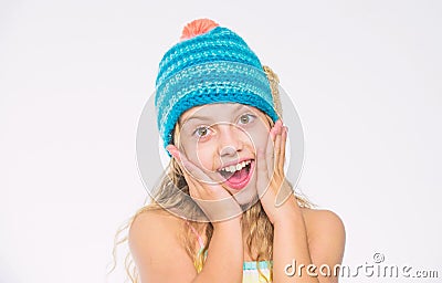 Girl long hair happy face white background. Kid wear warm soft knitted blue hat. Difference between knitting and crochet Stock Photo