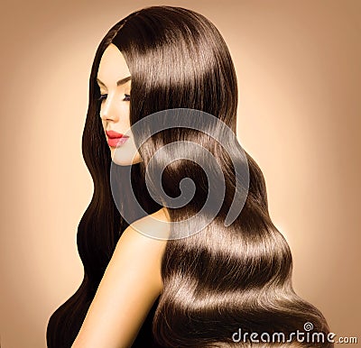 Woman with Long Healthy Wavy Hair. Stock Photo