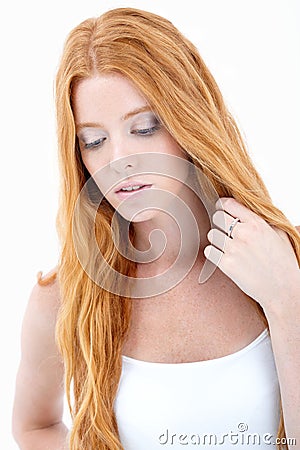 Girl with long red hair thinking Stock Photo