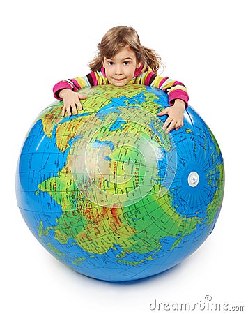 Girl look out of inflatable globe and embracing it Stock Photo