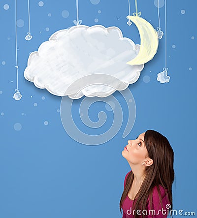 Girl looking at cartoon night clouds with moon hanging down Stock Photo