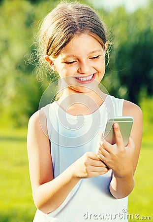 Girl looking at mobile phone Stock Photo