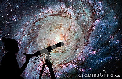 Girl looking at the stars with telescope. Messier 83 Stock Photo