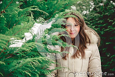 Girl looking trough tree branch Stock Photo