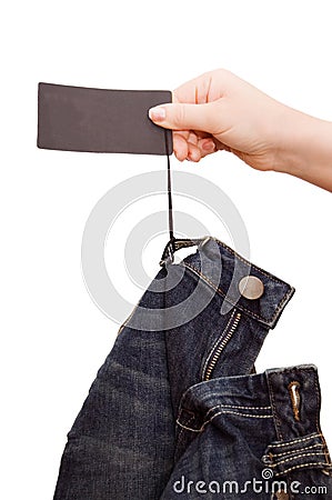 The girl looks a label on jeans Stock Photo