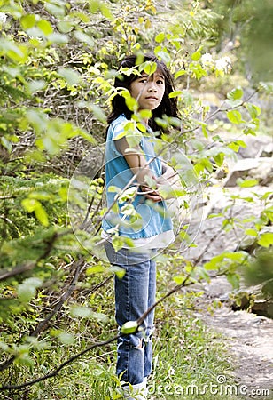 Girl lost in woods, scared Stock Photo