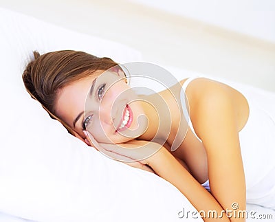 Girl lying on the bed. Morning Stock Photo