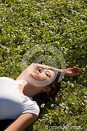 Girl Lying on Grass Stock Photo