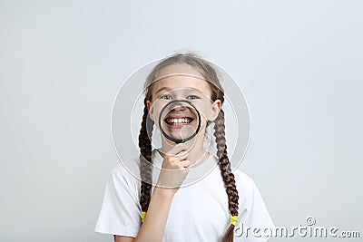 Girl with magnifying glass Stock Photo
