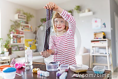 Girl making homemade slime toy Stock Photo