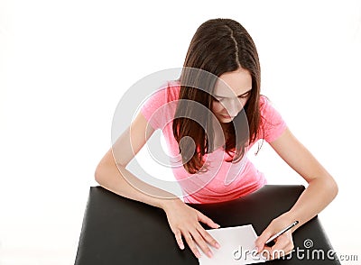 Girl with manicured hands writing Stock Photo