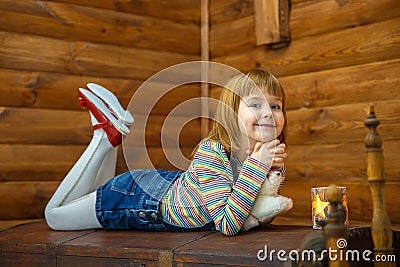 Girl Masha is lying on the old Stock Photo