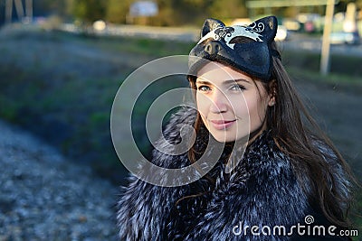 Girl in the mask and fur Stock Photo