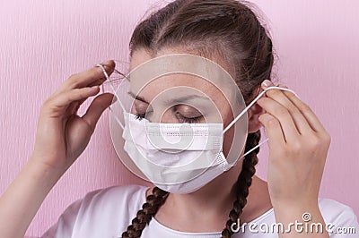 Girl in a medical mask. Stock Photo