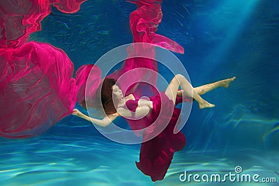 Girl mermaid. Underwater scene. A woman, a fashion model in the Stock Photo