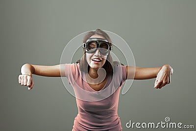 Girl mimics flying airplane Stock Photo