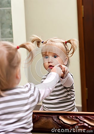 Girl and mirror Stock Photo