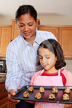 Girl And Mother With Cookies Stock Photo