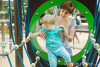 Girl with mother developing dexterity Stock Photo