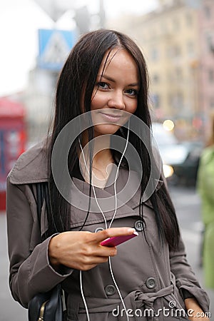 Girl with music player Stock Photo