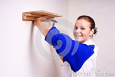 Girl nail on the shelf to the wall Stock Photo