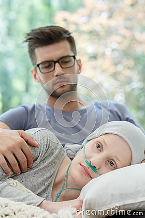 Girl with nasal cannula resting Stock Photo