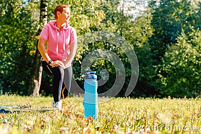 Girl in nature for sporting events. Sports water bottle. Healthy lifestyle Stock Photo