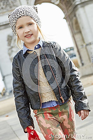 Girl near Arc de Triomphe in Paris, France going forward Stock Photo