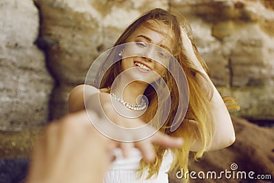 The girl is offered to marry on vacation. How to make a girl an offer on vacation, traveling. Gorgeous girl on the beach, the girl Stock Photo