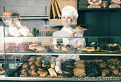 Girl offering desserts in the pastry shop Stock Photo