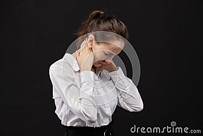 Girl office employee massages her neck from fatigue Stock Photo